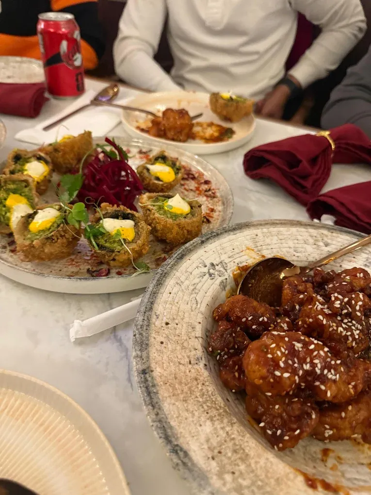 Signature Indian fine-dine platter at Ghazal Restaurant Tamarack Edmonton — butter chicken, biryani and tandoor specialities